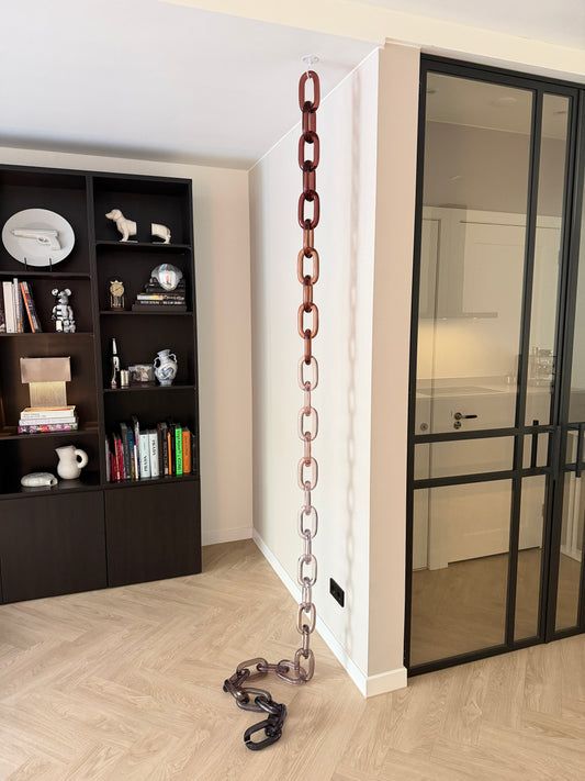 BRISÉNN Infinity Links displayed as a floor to ceiling acrylic art piece in a modern interior.