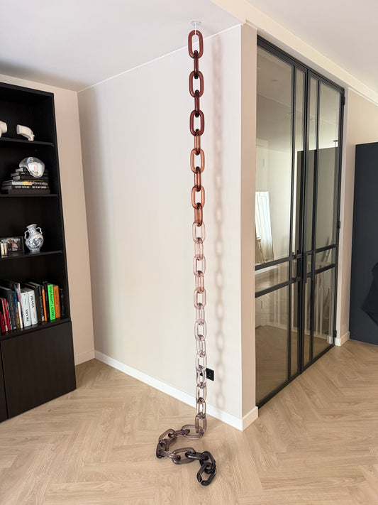 BRISÉNN Infinity Links displayed as a floor to ceiling acrylic art piece in a modern interior.