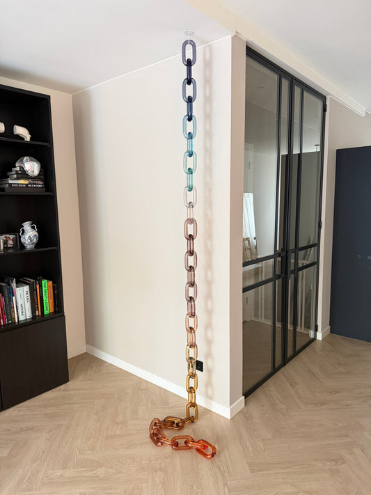 BRISÉNN Infinity Links displayed as a floor to ceiling acrylic art piece in a modern interior.