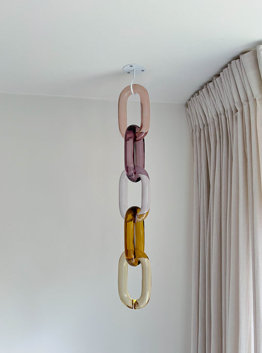 Modular oversized acrylic chain links wall decor by BRISÉNN